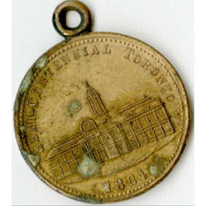 Rusting coin with loop on top and image of large building