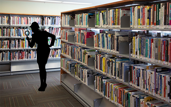 Silhouette of a sleuth with a magnifying glass in the library stacks